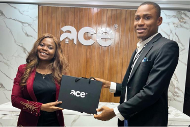 Aderinsola Jolaosho receiving an award from Ace Real Estate 